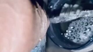 Pissing into the 500ml full bottle at a stretch in the sink with clear pee